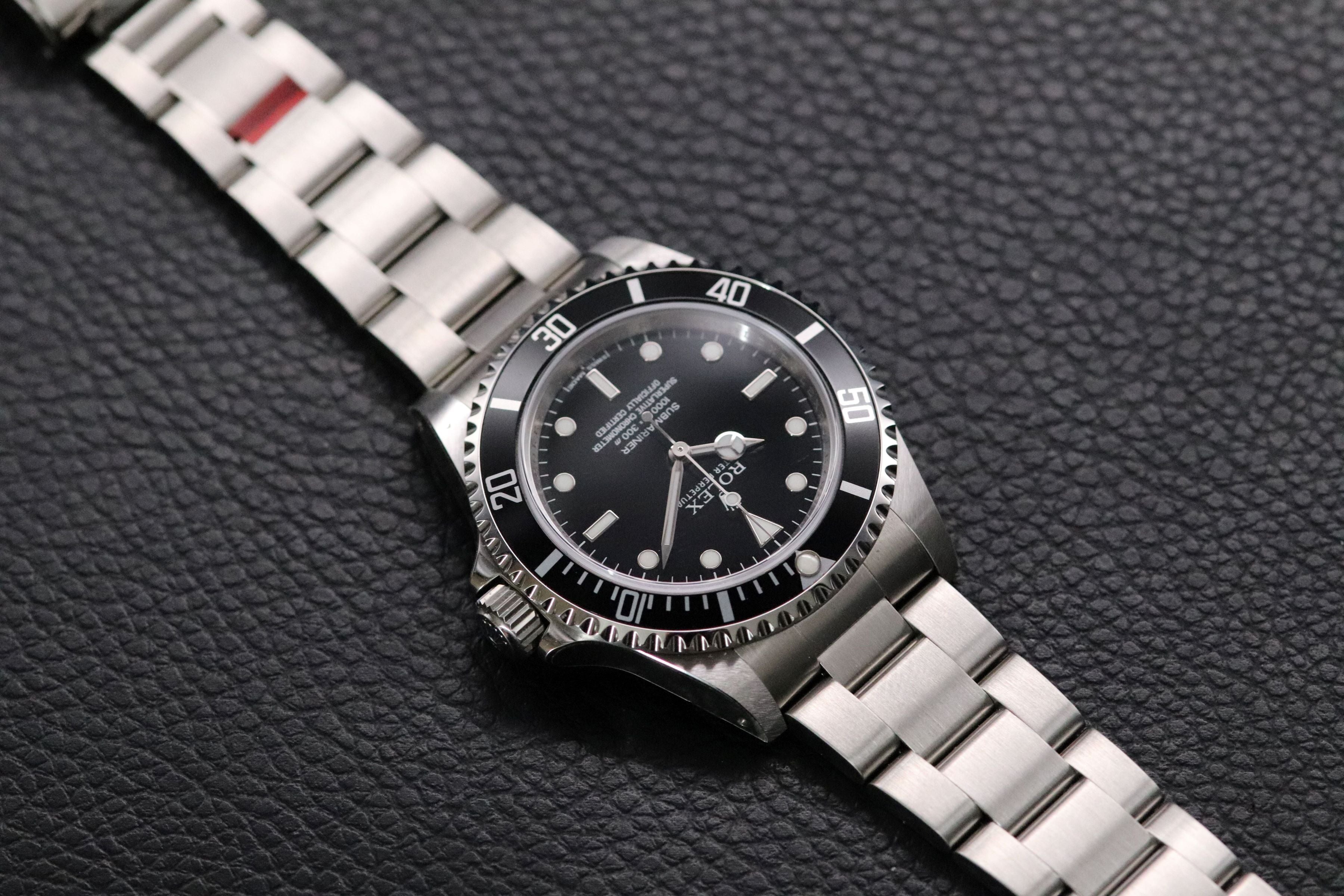 Rolex Submariner 14060M NOS Four-Liner 2009 Fullset